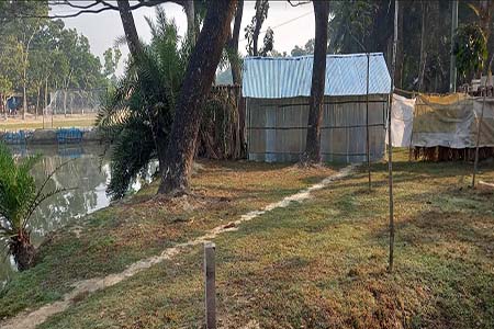 ঘর নির্মাণের অভিযোগে আটক
