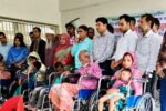 মান্দায় প্রতিবন্ধীদের মাঝে হুইল চেয়ার ও কর্নার বিতরণ